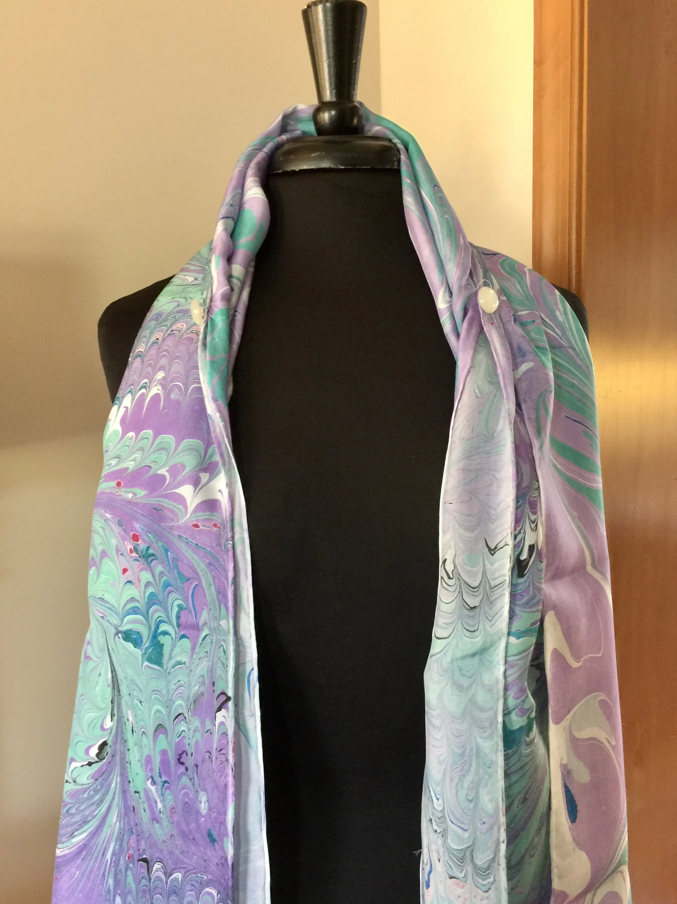 The Shibumi.  It’s a wrap, a shawl, a fashion statement!  Wear it 10 different ways!