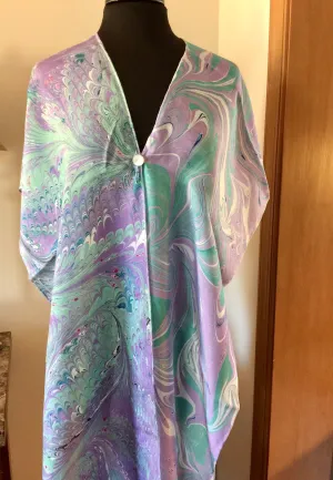 The Shibumi.  It’s a wrap, a shawl, a fashion statement!  Wear it 10 different ways!