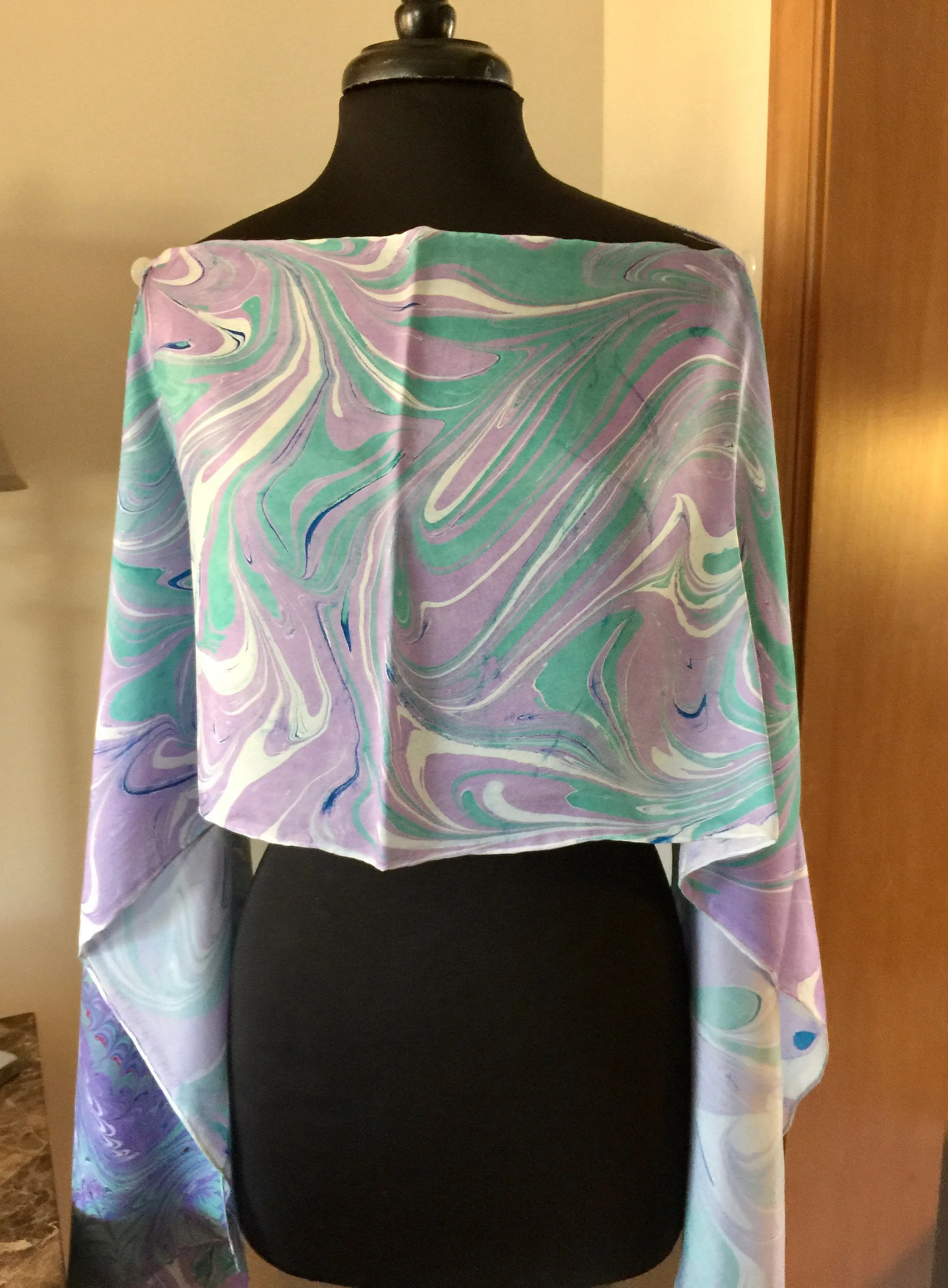 The Shibumi.  It’s a wrap, a shawl, a fashion statement!  Wear it 10 different ways!